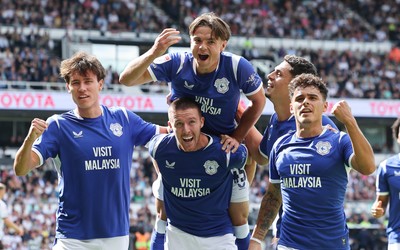 220826 - Derby County v Cardiff City, EFL Sky Bet Championship - Cian Ashford of Cardiff City celebrates on the shoulders of Jack Moylan of Cardiff City after scoring the first goal