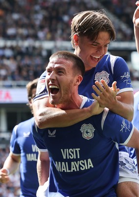220826 - Derby County v Cardiff City, EFL Sky Bet Championship - Cian Ashford of Cardiff City celebrates on the shoulders of Jack Moylan of Cardiff City after scoring the first goal