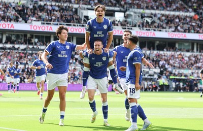 220826 - Derby County v Cardiff City, EFL Sky Bet Championship - Cian Ashford of Cardiff City celebrates on the shoulders of Jack Moylan of Cardiff City after scoring the first goal