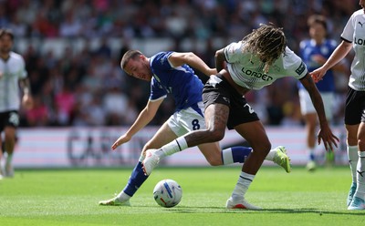220826 - Derby County v Cardiff City, EFL Sky Bet Championship - Jack Moylan of Cardiff City takes on Dion Sanderson of Derby County
