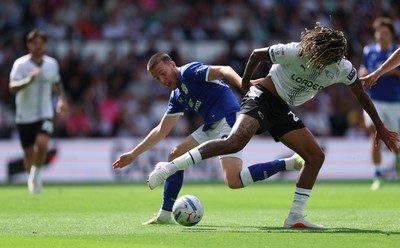 220826 - Derby County v Cardiff City, EFL Sky Bet Championship - Jack Moylan of Cardiff City takes on Dion Sanderson of Derby County