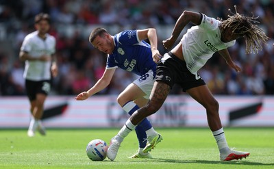 220826 - Derby County v Cardiff City, EFL Sky Bet Championship - Jack Moylan of Cardiff City takes on Dion Sanderson of Derby County