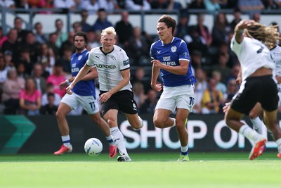 220826 - Derby County v Cardiff City, EFL Sky Bet Championship - Rubin Colwill of Cardiff City races through to set up goal for Yousef Salech of Cardiff City