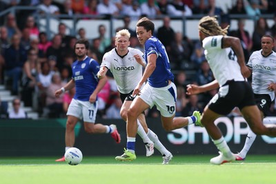 220826 - Derby County v Cardiff City, EFL Sky Bet Championship - Rubin Colwill of Cardiff City races through to set up goal for Yousef Salech of Cardiff City