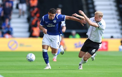 220826 - Derby County v Cardiff City, EFL Sky Bet Championship - Yousef Salech of Cardiff City and Sondre Langas of Derby County compete for the ball