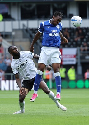 220826 - Derby County v Cardiff City, EFL Sky Bet Championship - Ronan Kpakio of Cardiff City heads the ball forward