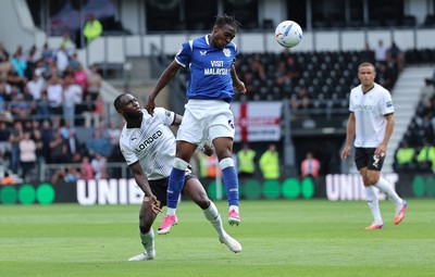 220826 - Derby County v Cardiff City, EFL Sky Bet Championship - Ronan Kpakio of Cardiff City heads the ball forward