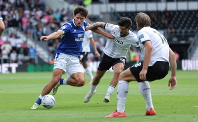 220826 - Derby County v Cardiff City, EFL Sky Bet Championship - Rubin Colwill of Cardiff City holds off Alex Mowatt of Derby County