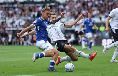 220826 - Derby County v Cardiff City, EFL Sky Bet Championship - Isaak Davies of Cardiff City sees his shot at goal blocked by Charlie Taylor of Derby County