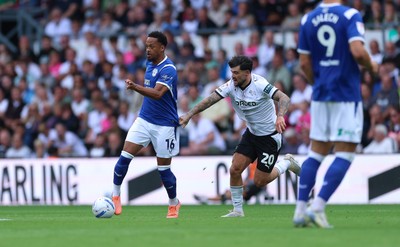220826 - Derby County v Cardiff City, EFL Sky Bet Championship - Chris Willock of Cardiff City takes on Alex Mowatt of Derby County