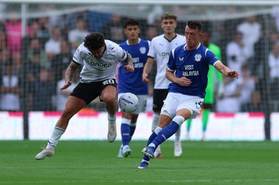 220826 - Derby County v Cardiff City, EFL Sky Bet Championship - David Turnbull of Cardiff City and Alex Mowatt of Derby County compete for the ball