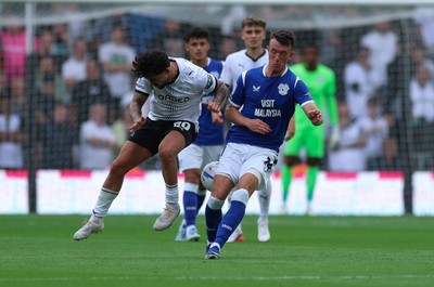 220826 - Derby County v Cardiff City, EFL Sky Bet Championship - David Turnbull of Cardiff City and Alex Mowatt of Derby County compete for the ball