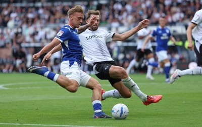 220826 - Derby County v Cardiff City, EFL Sky Bet Championship - Isaak Davies of Cardiff City sees his shot at goal blocked by Charlie Taylor of Derby County