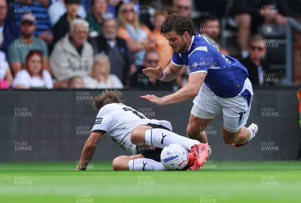 220826 - Derby County v Cardiff City, EFL Sky Bet Championship - Ollie Tanner of Cardiff City is brought down by Charlie Taylor of Derby County