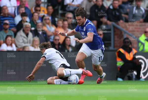 220826 - Derby County v Cardiff City, EFL Sky Bet Championship - Ollie Tanner of Cardiff City is brought down by Charlie Taylor of Derby County