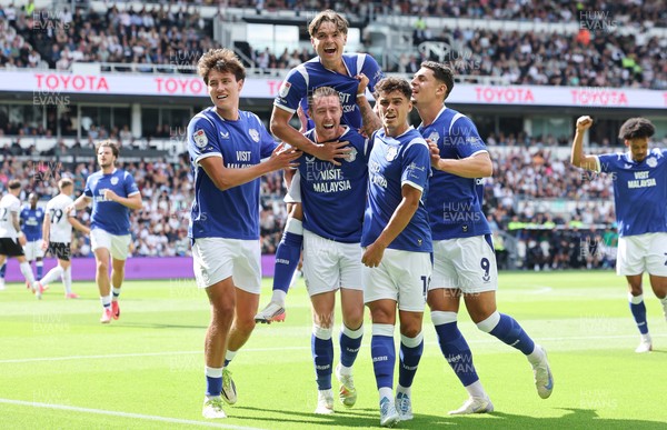 220826 - Derby County v Cardiff City, EFL Sky Bet Championship - Cian Ashford of Cardiff City celebrates on the shoulders of Jack Moylan of Cardiff City after scoring the first goal