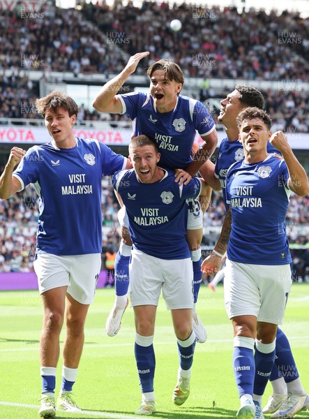 220826 - Derby County v Cardiff City, EFL Sky Bet Championship - Cian Ashford of Cardiff City celebrates on the shoulders of Jack Moylan of Cardiff City after scoring the first goal