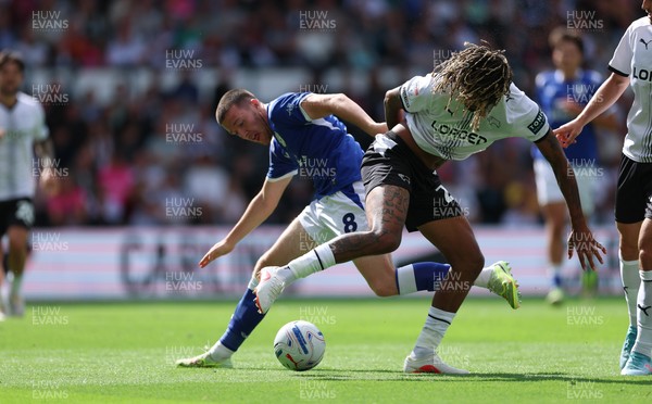 220826 - Derby County v Cardiff City, EFL Sky Bet Championship - Jack Moylan of Cardiff City takes on Dion Sanderson of Derby County