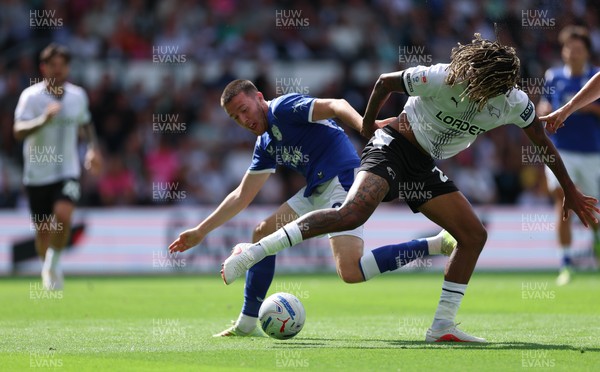 220826 - Derby County v Cardiff City, EFL Sky Bet Championship - Jack Moylan of Cardiff City takes on Dion Sanderson of Derby County