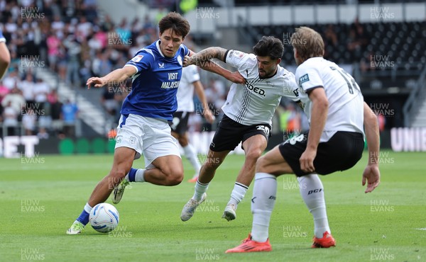 220826 - Derby County v Cardiff City, EFL Sky Bet Championship - Rubin Colwill of Cardiff City holds off Alex Mowatt of Derby County