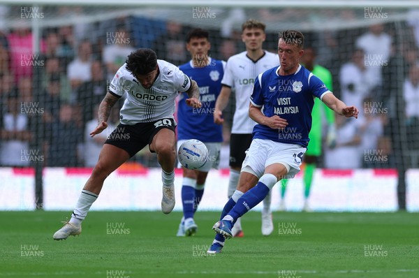 220826 - Derby County v Cardiff City, EFL Sky Bet Championship - David Turnbull of Cardiff City and Alex Mowatt of Derby County compete for the ball