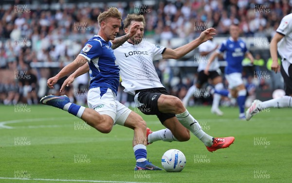 220826 - Derby County v Cardiff City, EFL Sky Bet Championship - Isaak Davies of Cardiff City sees his shot at goal blocked by Charlie Taylor of Derby County