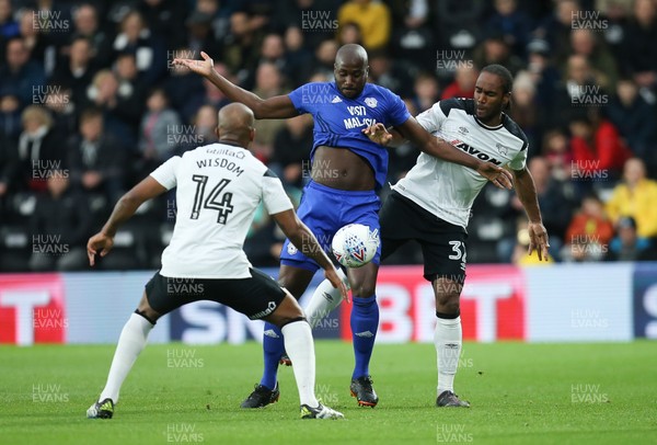 240418 - Derby County v Cardiff City, Sky Bet Championship - Sol Bamba of Cardiff City holds off Andre Wisdom of Derby County and Cameron Jerome of Derby County