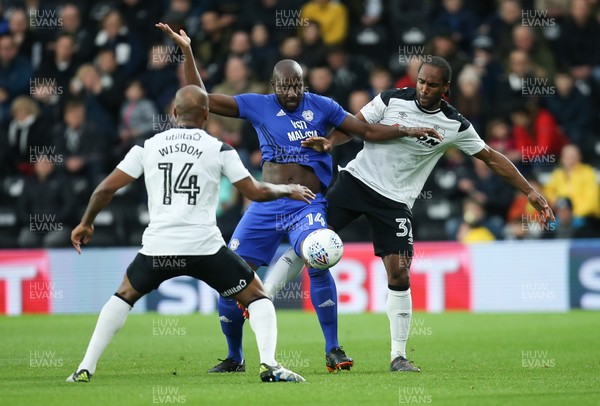 240418 - Derby County v Cardiff City, Sky Bet Championship - Sol Bamba of Cardiff City holds off Andre Wisdom of Derby County and Cameron Jerome of Derby County