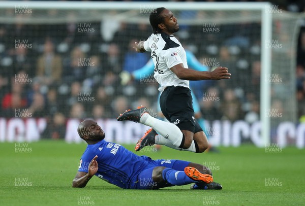240418 - Derby County v Cardiff City, Sky Bet Championship - Cameron Jerome of Derby County is brought down by Sol Bamba of Cardiff City