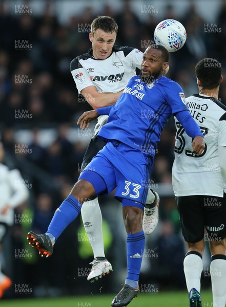 240418 - Derby County v Cardiff City, Sky Bet Championship - Junior Hoilett of Cardiff City and Craig Forsyth of Derby County compete for the ball