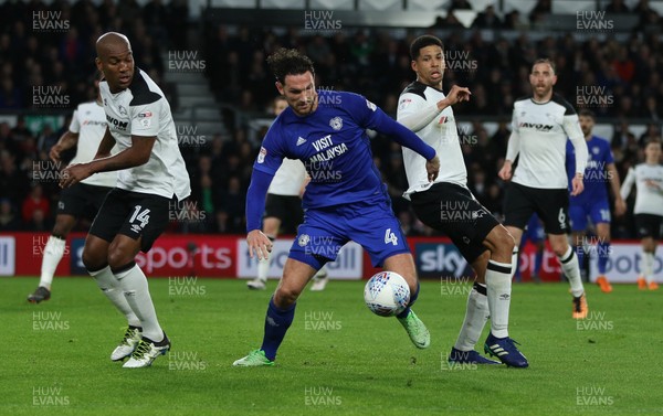 240418 - Derby County v Cardiff City, Sky Bet Championship - Sean Morrison of Cardiff City wins the ball from Andre Wisdom of Derby County and Curtis Davies of Derby County
