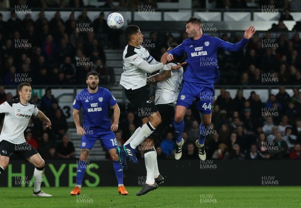 240418 - Derby County v Cardiff City, Sky Bet Championship - Gary Madine of Cardiff City heads the ball towards goal