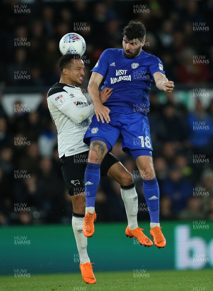 240418 - Derby County v Cardiff City, Sky Bet Championship - Callum Paterson of Cardiff City and Marcus Olsson of Derby County compete for the ball