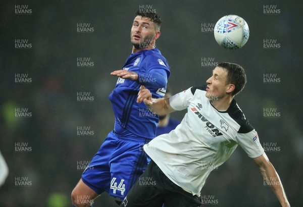 240418 - Derby County v Cardiff City, Sky Bet Championship - Gary Madine of Cardiff City and Craig Forsyth of Derby County compete for the ball