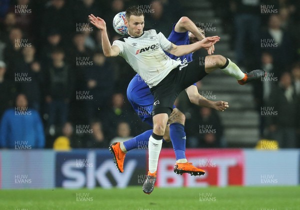 240418 - Derby County v Cardiff City, Sky Bet Championship - Andreas Weimann of Derby County and Callum Paterson of Cardiff City compete for the ball