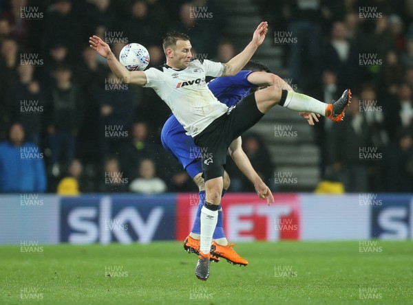 240418 - Derby County v Cardiff City, Sky Bet Championship - Andreas Weimann of Derby County and Callum Paterson of Cardiff City compete for the ball