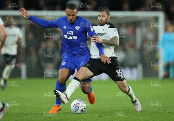 240418 - Derby County v Cardiff City, Sky Bet Championship - Kenneth Zohore of Cardiff City is challenged by Bradley Johnson of Derby County