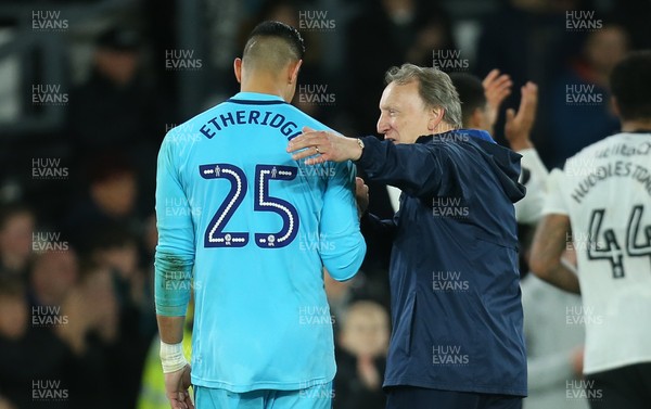 240418 - Derby County v Cardiff City, Sky Bet Championship - Cardiff City manager Neil Warnock consoles Cardiff City goalkeeper Neil Etheridge at the end of the match