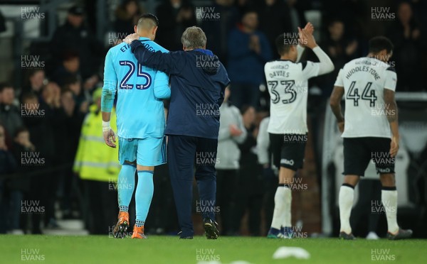 240418 - Derby County v Cardiff City, Sky Bet Championship - Cardiff City manager Neil Warnock consoles Cardiff City goalkeeper Neil Etheridge at the end of the match
