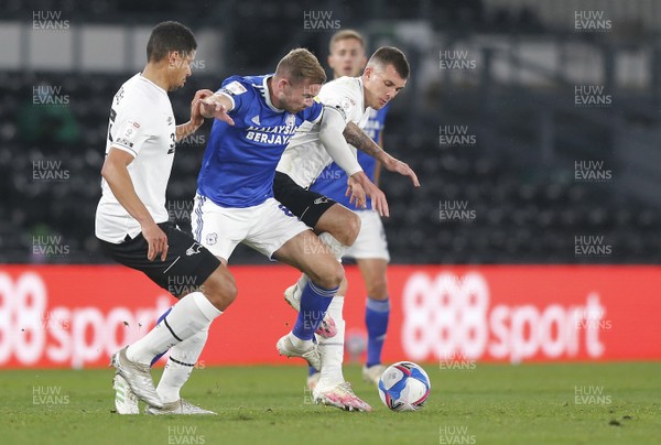 281020 - Derby County v Cardiff City - Sky Bet Championship - Joe Ralls of Cardiff is tackled by Curtis Davies of Derby and Jason Knight of Derby