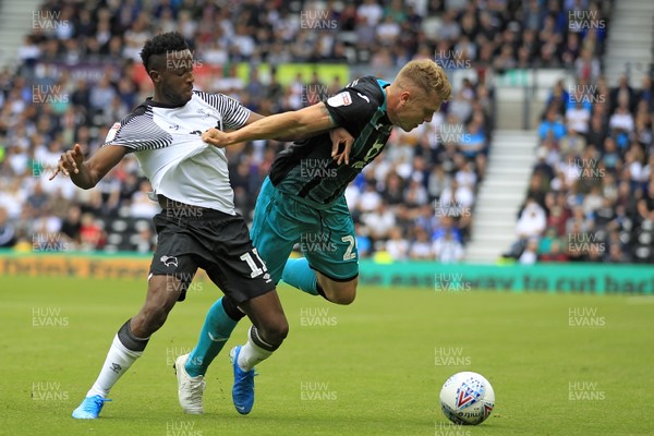 100819 - Derby County v Swansea City, Sky Bet Championship - Jake Bidwell of Swansea City (right) and Florian Jozefzoon of Derby County battle for the ball