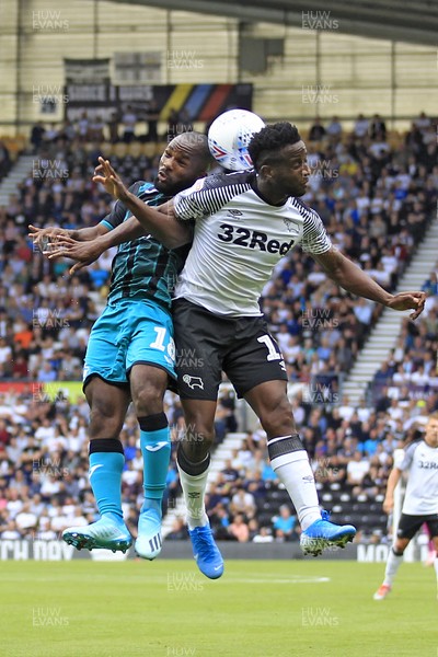100819 - Derby County v Swansea City, Sky Bet Championship - Aldo Kalulu of Swansea City (left) in action with Florian Jozefzoon of Derby County