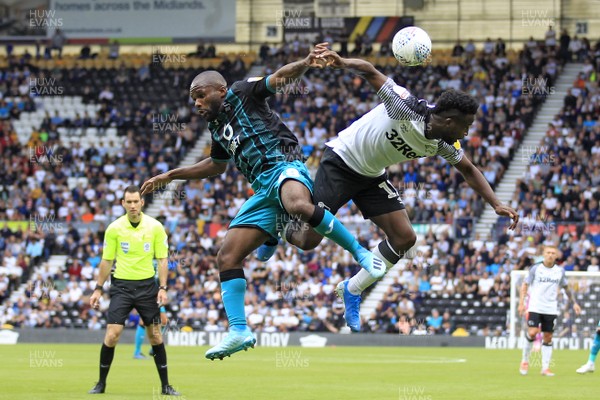 100819 - Derby County v Swansea City, Sky Bet Championship - Aldo Kalulu of Swansea City (left) in action with Florian Jozefzoon of Derby County