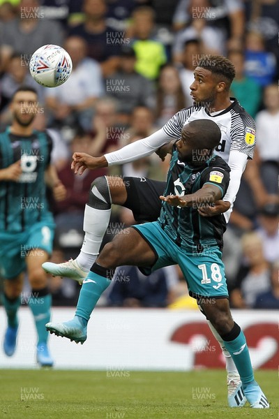 100819 - Derby County v Swansea City, Sky Bet Championship - Aldo Kalulu of Swansea City (front) and Jayden Bogle of Derby County battle for the ball