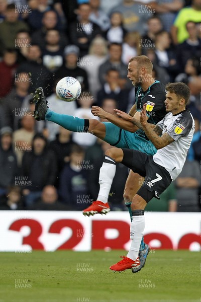 100819 - Derby County v Swansea City, Sky Bet Championship - Mike van der Hoorn of Swansea City (left) in action with  Jamie Paterson of Derby County