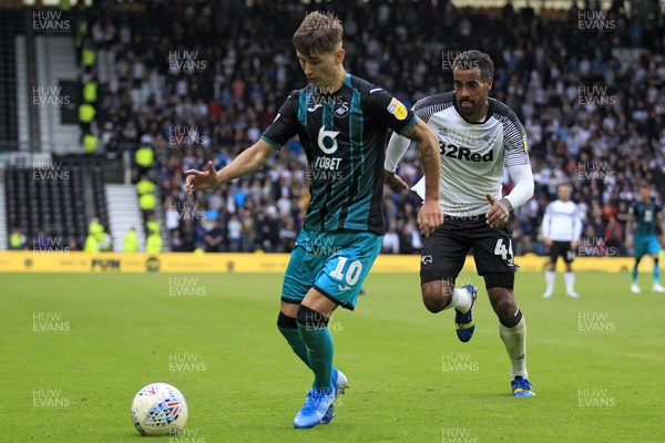 100819 - Derby County v Swansea City, Sky Bet Championship - Bersant Celina of Swansea City (left) in action with Tom Huddlestone of Derby County