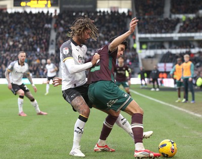 140226 - Derby County v Swansea City - Sky Bet Championship - Marko Stamenic of Swansea and Dion Sanderson of Derby