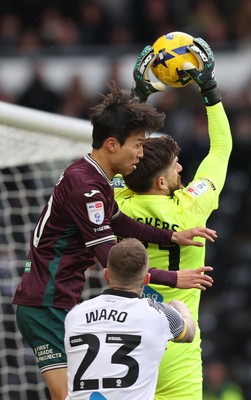 140226 - Derby County v Swansea City - Sky Bet Championship - Goalkeeper Josh Vickers of Derby saves from Eom Ji-sung of Swansea