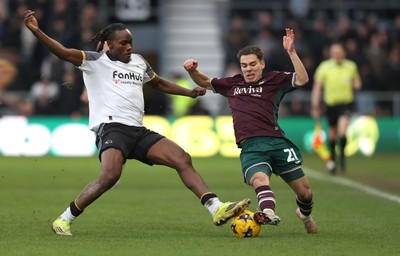 140226 - Derby County v Swansea City - Sky Bet Championship - Manuel Benson of Swansea and David Ozoh of Derby clash in the 2nd half