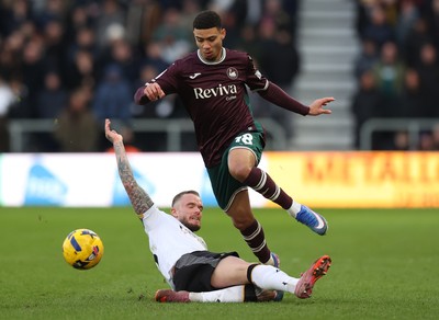 140226 - Derby County v Swansea City - Sky Bet Championship - Gustavo Nunes of Swansea and Joe Ward of Derby